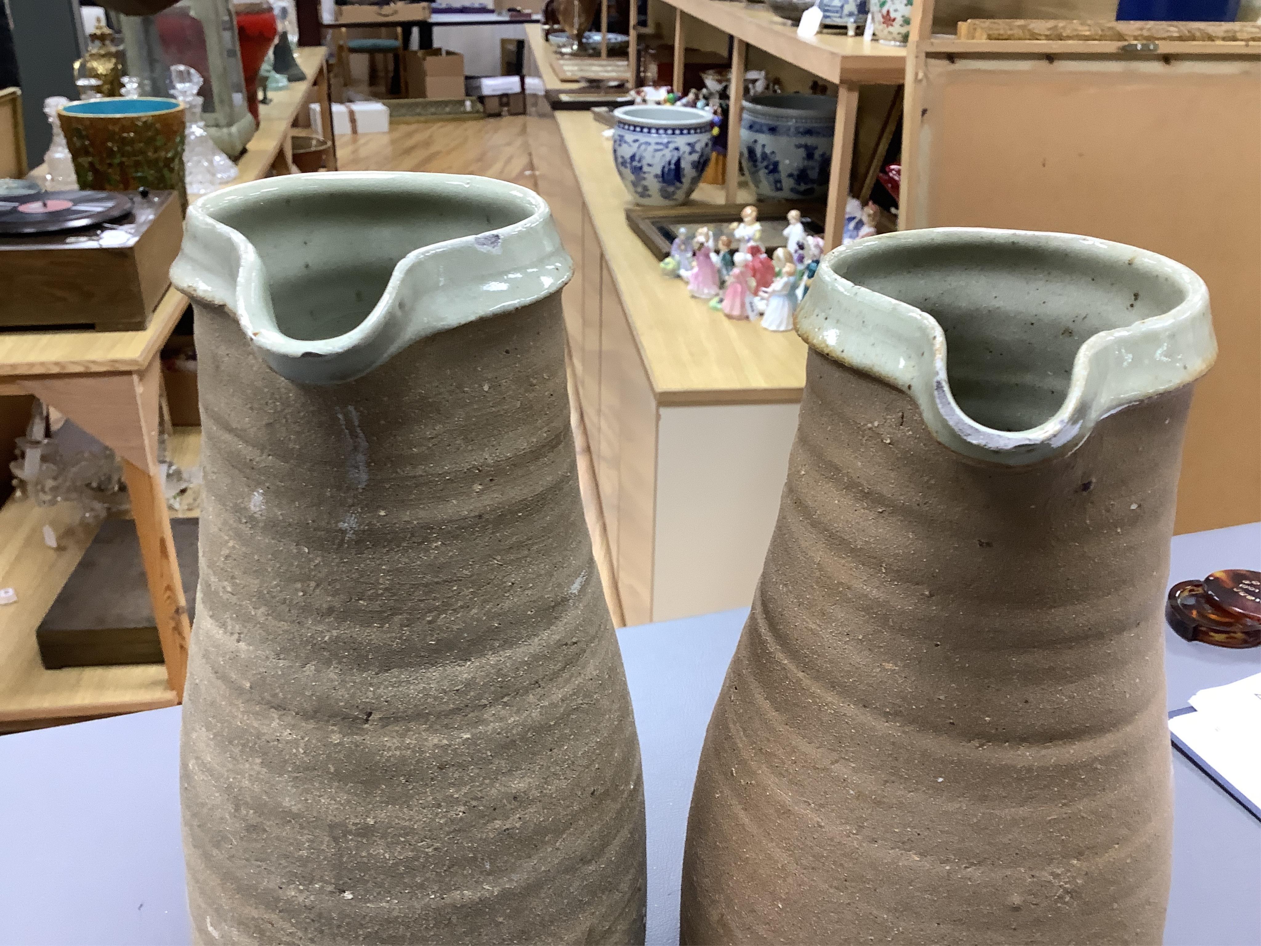 A group of Leach St. Ives pottery jugs and a pot and three other studio items of studio ceramics, some with impressed marks, largest 25cm high